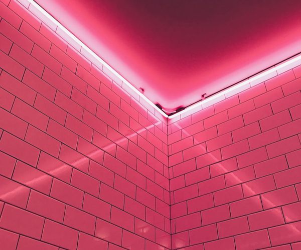 Minimalist wave patterns glowing with soft neon indigo light